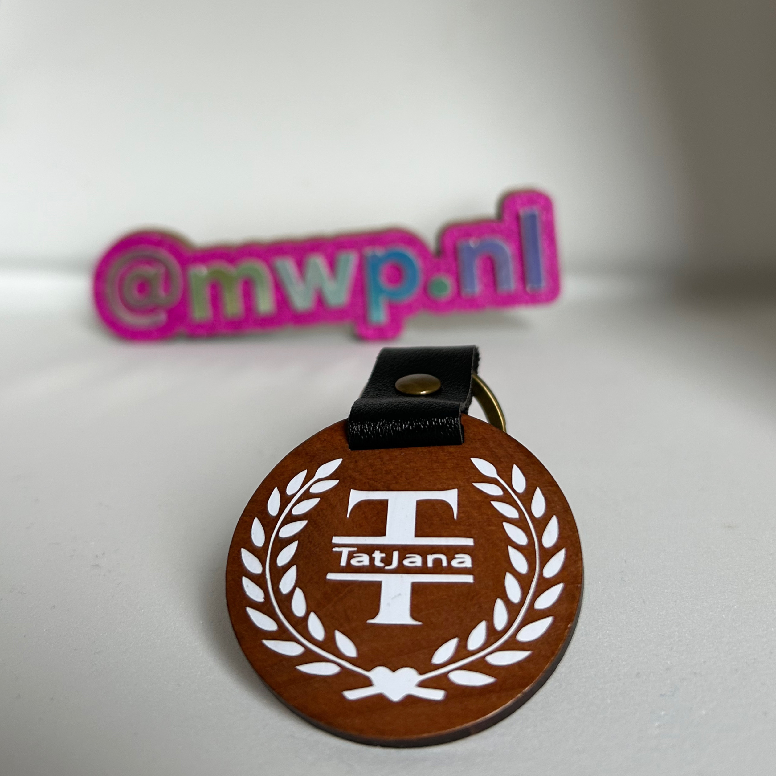 Houten sleutelhanger met daarop een naam